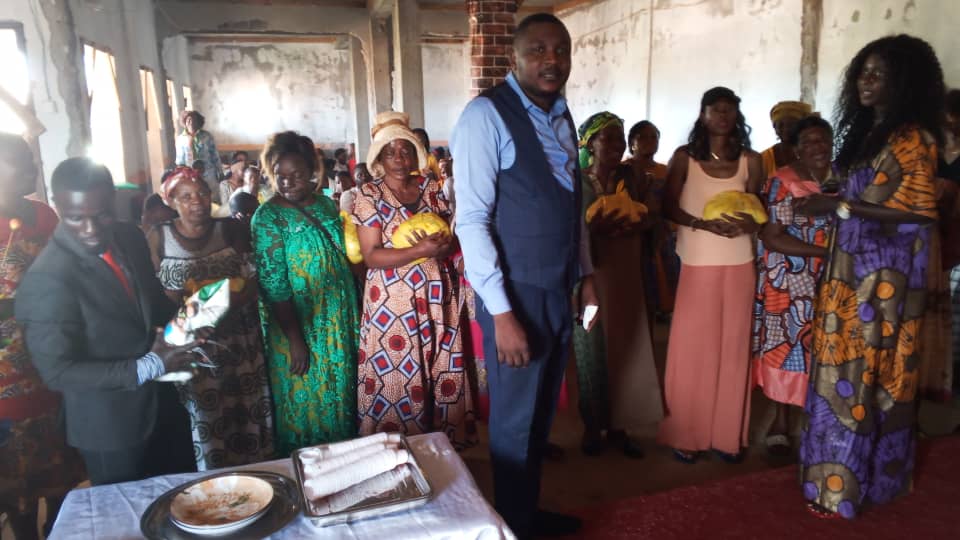Food items being presented to orphanage staff