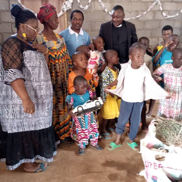 ZIM Foundation members with children during the Christmas celebration